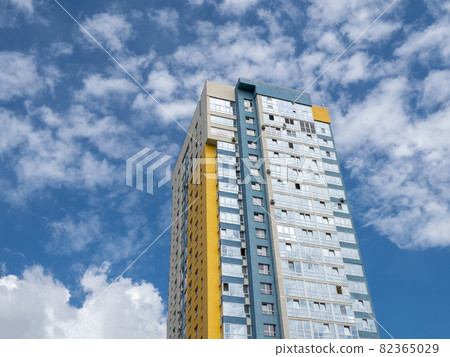Modern beautiful new buildings. Colored wall on the background of blue sky. Modern beautiful new buildings. Colored wall on the background of blue sky. 82365029
