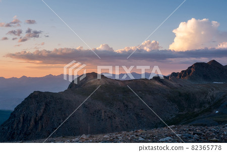 Altai mountains at dawn. Atmospheric landscape with silhouettes of mountains on background of pink dawn sky. Colorful nature scenery with sunset or sunrise. Sundown in faded tones. Altai mountains at dawn. Atmospheric landscape with silhouettes of mountains on background of pink dawn sky. Colorful nature scenery with sunset or sunrise. Sundown in faded tones. 82365778