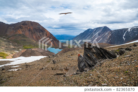 Panoramic highland scenery with sharpened stones of unusual shape. Awesome scenic mountain landscape with big cracked pointed stones closeup under dramatic sky. Sharp rocks with cracks. Panoramic highland scenery with sharpened stones of unusual shape. Awesome scenic mountain landscape with big cracked pointed stones closeup under dramatic sky. Sharp rocks with cracks. 82365870