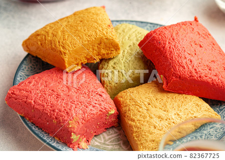 Assortment of colorful Turkish halva cakes on plate 82367725