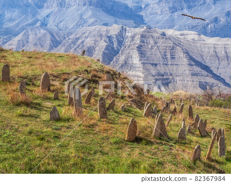Nameless stone tombstones on the mountainside. Tombstones made of stone. 82367984
