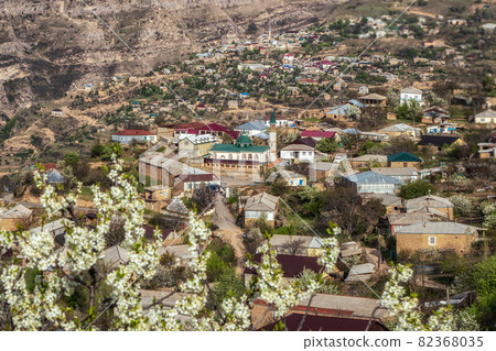 Mosque in the center of a mountain village. Landscape and countryside of cityscape in Goor. Dagestan. Mosque in the center of a mountain village. Landscape and countryside of cityscape in Goor. Dagestan. 82368035