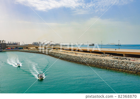 View of speed motor boat going on high speed near coast line 82368870