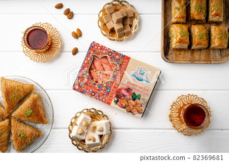 Top view of Turkish desserts on wooden background Top view of Turkish desserts on wooden background 82369681