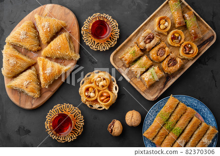 Turkish tea in traditional glasses baklava on black background 82370306