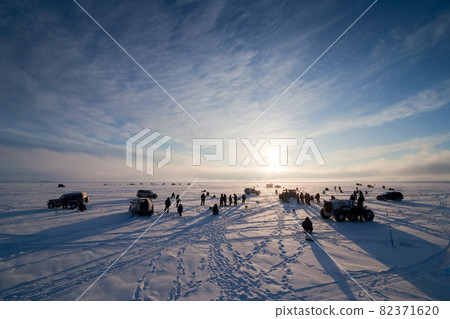 Winter ice fishing in the Arctic. Winter ice fishing in the Arctic. 82371620