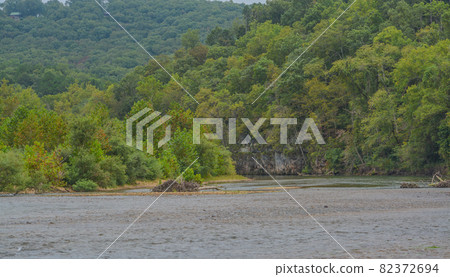 The Current River flows through the Mountains of Ozark National Scenic Riverway of Round Spring, Shannon County, Missouri The Current River flows through the Mountains of Ozark National Scenic Riverway of Round Spring, Shannon County, Missouri 82372694