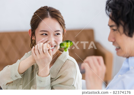 Men who are tired of eating broccoli and women who try to feed it Men who are tired of eating broccoli and women who try to feed it 82374176