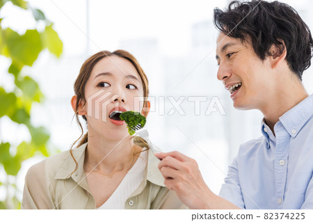 Couples incorporating broccoli into their diet 82374225