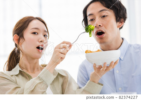 Couples incorporating broccoli into their diet Couples incorporating broccoli into their diet 82374227
