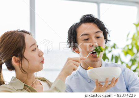 Couples incorporating broccoli into their diet Couples incorporating broccoli into their diet 82374229