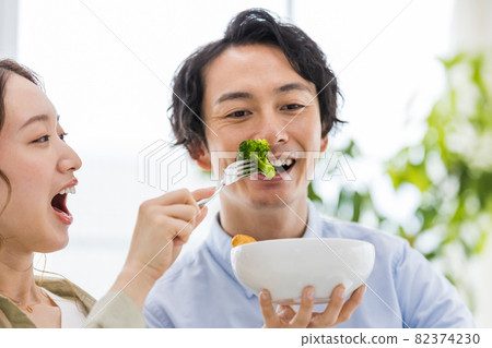 Couples incorporating broccoli into their diet Couples incorporating broccoli into their diet 82374230