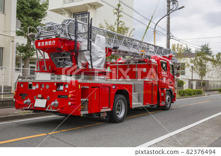 Waiting fire engine, fire engine, emergency vehicle, behind the ladder vehicle Waiting fire engine, fire engine, emergency vehicle, behind the ladder vehicle 82376494