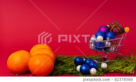 Tangerines and christmas tree toys in a New Year's composition. New Year's still life Tangerines and christmas tree toys in a New Year's composition. New Year's still life 82378560