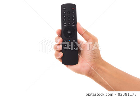 Hand holding television and audio remote control 82381175