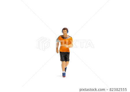 Miniature people, Man in fitness wear running on white background 82382555