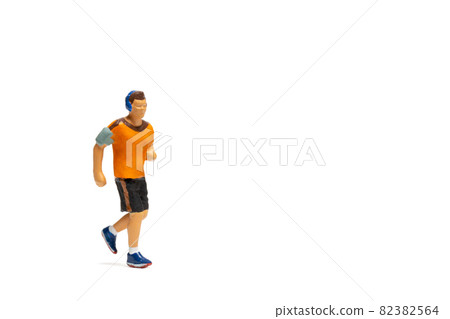 Miniature people, Man in fitness wear running on white background Miniature people, Man in fitness wear running on white background 82382564