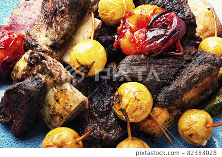 Beef ribs with plums and pears sauce 82383028