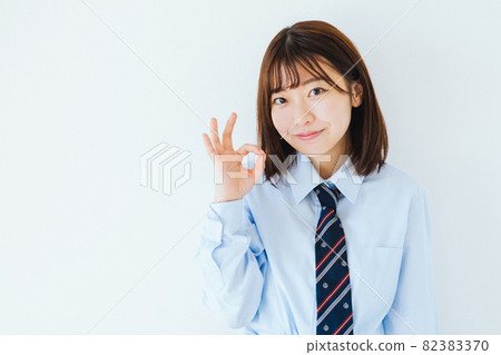 High school girl giving an okay sign High school girl giving an okay sign 82383370