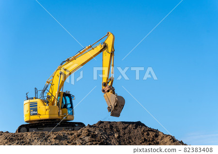 Hydraulic excavator blue sky 82383408
