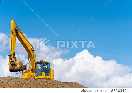 Hydraulic excavator blue sky 82383414