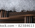 Thick frost or snow on textured plastic garden furniture, close up 82384613