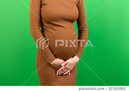 urinary incontinence during pregnancy. Abdominal pain during pregnancy. Maternity healthcare concept on colored background 82385062