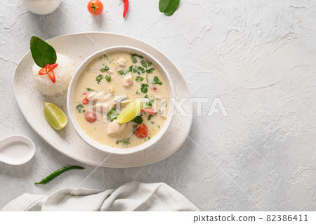 Asian Tom Kha Gai soup. Spicy coconut with chicken, cherry tomato. Asian Tom Kha Gai soup. Spicy coconut with chicken, cherry tomato. 82386411