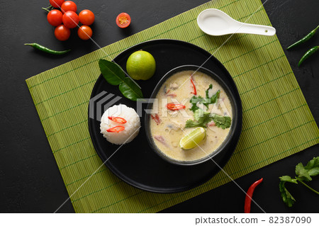 Asian Tom Kha Gai soup. Spicy coconut with chicken, cherry tomato. Asian Tom Kha Gai soup. Spicy coconut with chicken, cherry tomato. 82387090