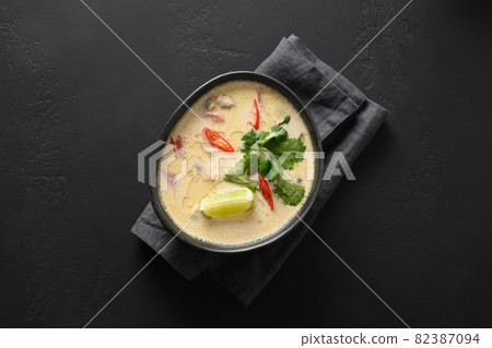 Asian Tom Kha Gai soup. Spicy coconut with chicken, cherry tomato. Asian Tom Kha Gai soup. Spicy coconut with chicken, cherry tomato. 82387094