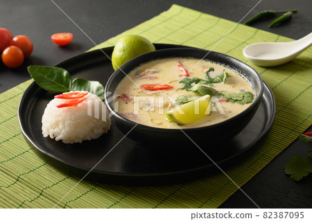 Asian Tom Kha Gai soup. Spicy coconut with chicken, cherry tomato. Asian Tom Kha Gai soup. Spicy coconut with chicken, cherry tomato. 82387095