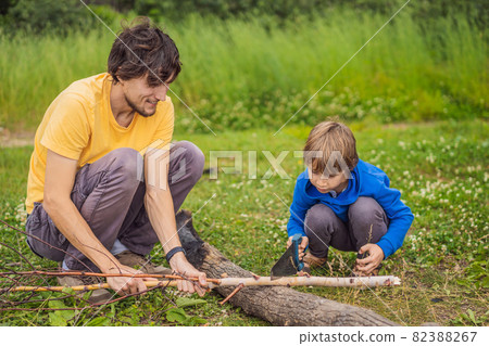 Father and son working with tools outdoor 82388267