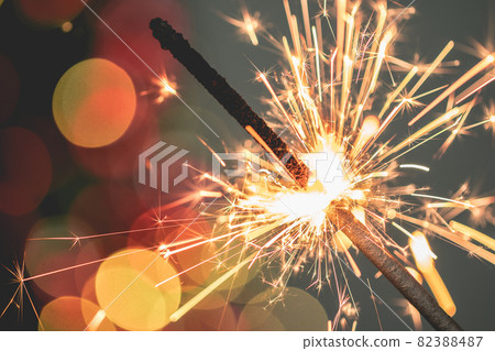 Close-up of holiday Christmas sparkler on dark background 82388487