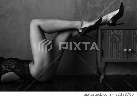 Woman's legs, beautiful smooth skin.The beauty of the female body, natural woman ,young woman in black lingerie Woman's legs, beautiful smooth skin.The beauty of the female body, natural woman ,young woman in black lingerie 82388790
