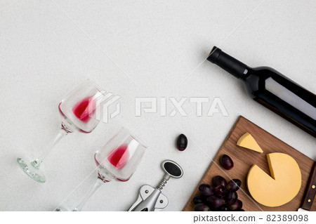 Wine, glasses and corkscrew over white background. Top view Wine, glasses and corkscrew over white background. Top view 82389098