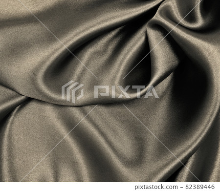 Smooth elegant brown silk or satin texture as abstract background. Luxurious background design. In Sepia toned. Retro style Smooth elegant brown silk or satin texture as abstract background. Luxurious background design. In Sepia toned. Retro style 82389446