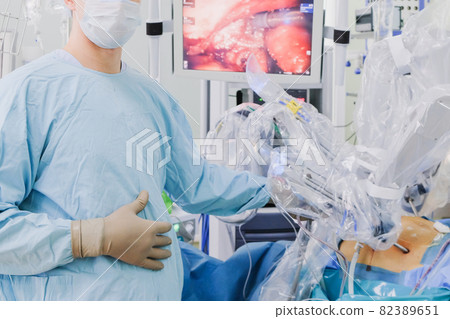 The process of carrying out a surgical operation using a modern robotic surgical system. Medical robot.  82389651