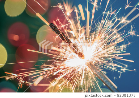 Close-up of holiday Christmas sparkler on dark background 82391375