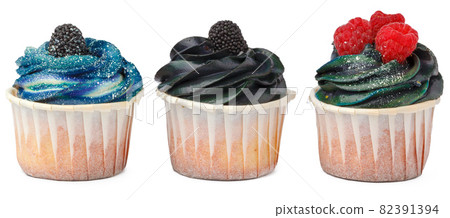 Three yummy cupcakes with icing isolated on white background Three yummy cupcakes with icing isolated on white background 82391394