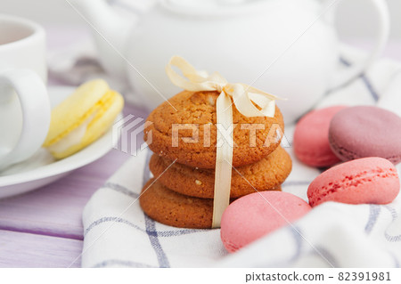 Homemade crunchy cookies and tea on a wooden table Homemade crunchy cookies and tea on a wooden table 82391981