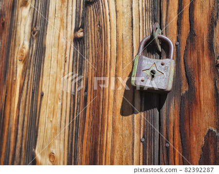 Aged board doors and padlocks Aged board doors and padlocks 82392287