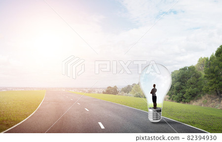 Businesswoman inside light bulb 82394930