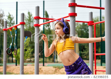 Schoolgirl preteen workout on sports ground Schoolgirl preteen workout on sports ground 82396035