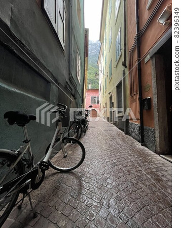 old houses on a street in riva del garda old houses on a street in riva del garda 82396349