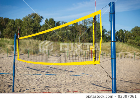 Volleyball yellow net on sand at beach. Sport and healthy lifestyles on fresh air 82397061