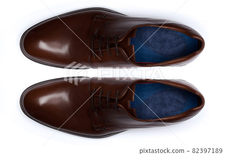 Classic male leather shoes isolated on a white, top view. 82397189