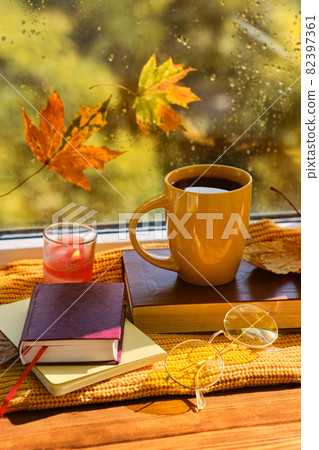 book with glasses, cup of coffee, autumn leaves, wool sweater 82397361