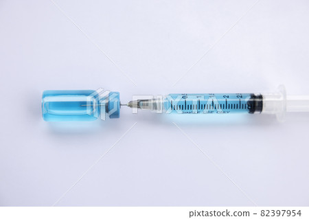 Close-up vials with vaccine and syringe for virus protection isolated on white background. Horizontal composition. 82397954