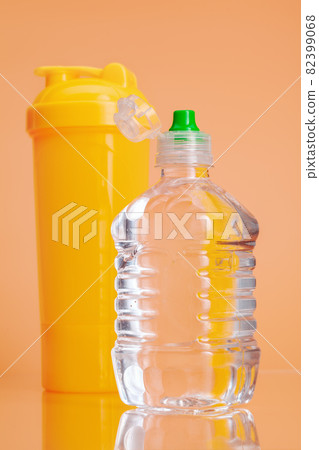 Plastic water bottles on a pastel beige background 82399068