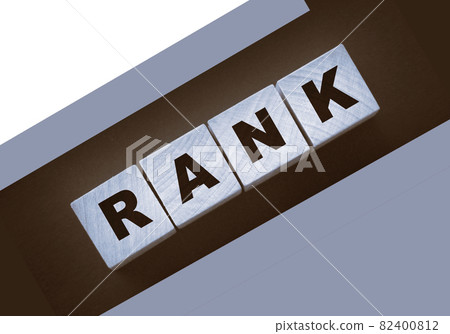 RANK text on a black background on wooden cubes. Ranking SEO concept 82400812